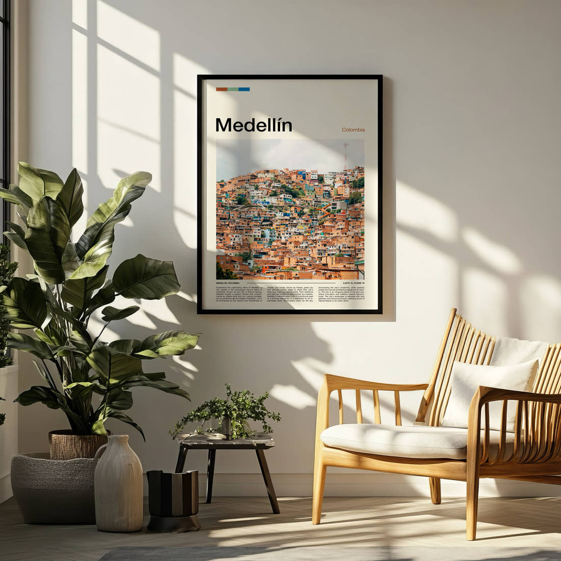 Medellín Colourful Hillside Houses Travel Print framed on a pale wall beside houseplants