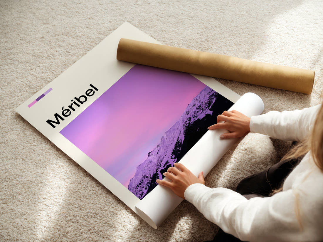 Meribel Snowy Mountains At Dusk Travel Print being unrolled from its postal tube