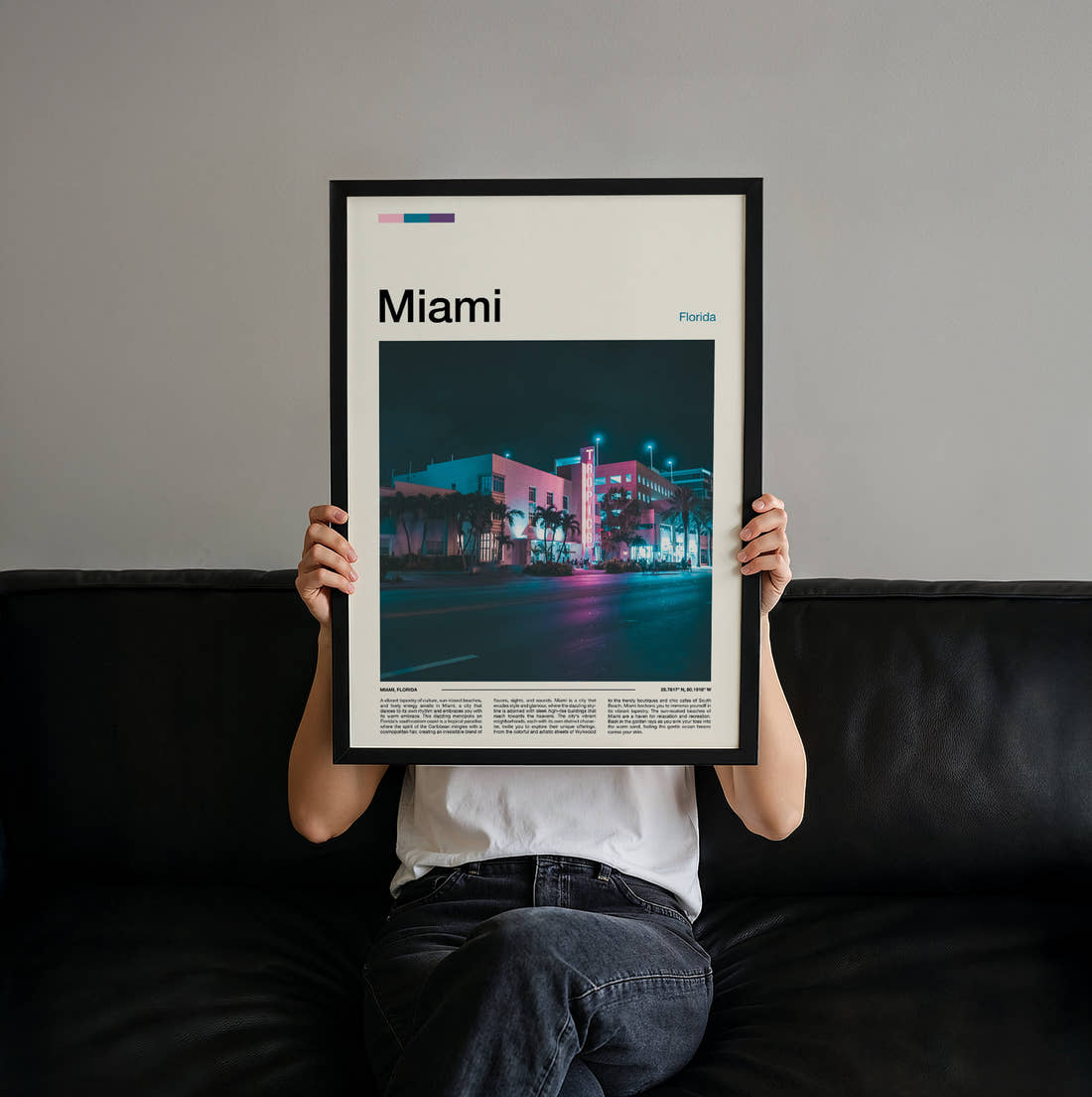 Miami Neon Art Deco Building Travel Print held up by hand to show the size of the print