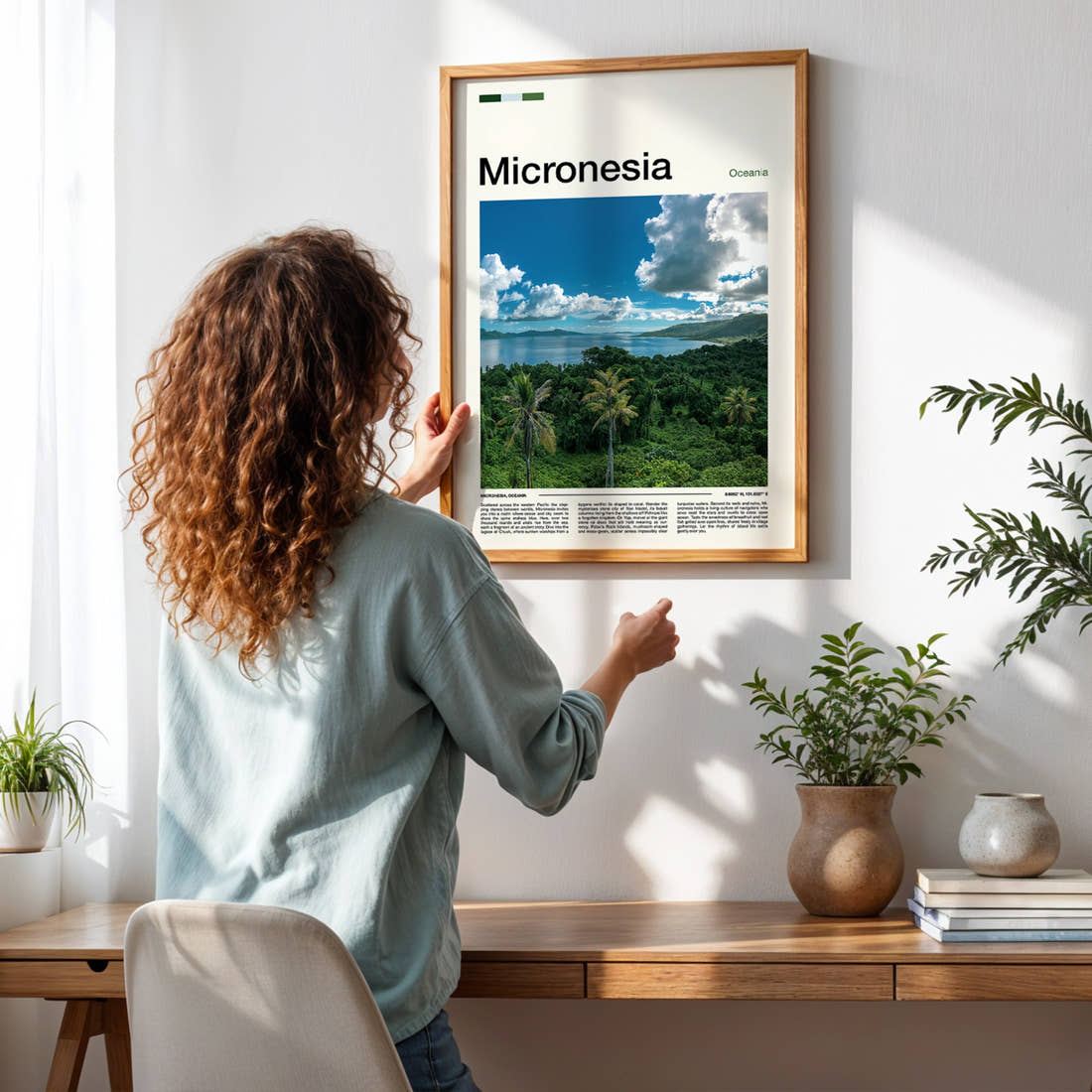 Micronesia Lagoon From Above Travel Print framed on a pale wall beside houseplants