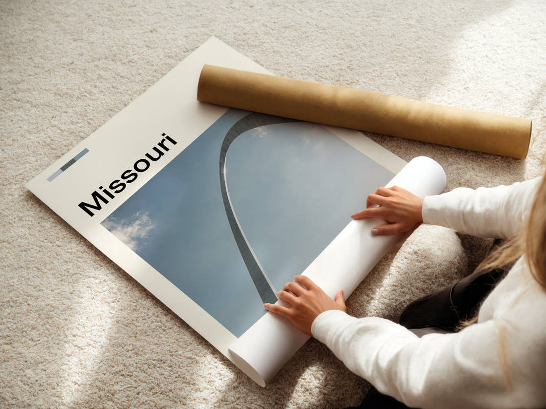 Missouri Gateway Arch Travel Print being unrolled from its postal tube