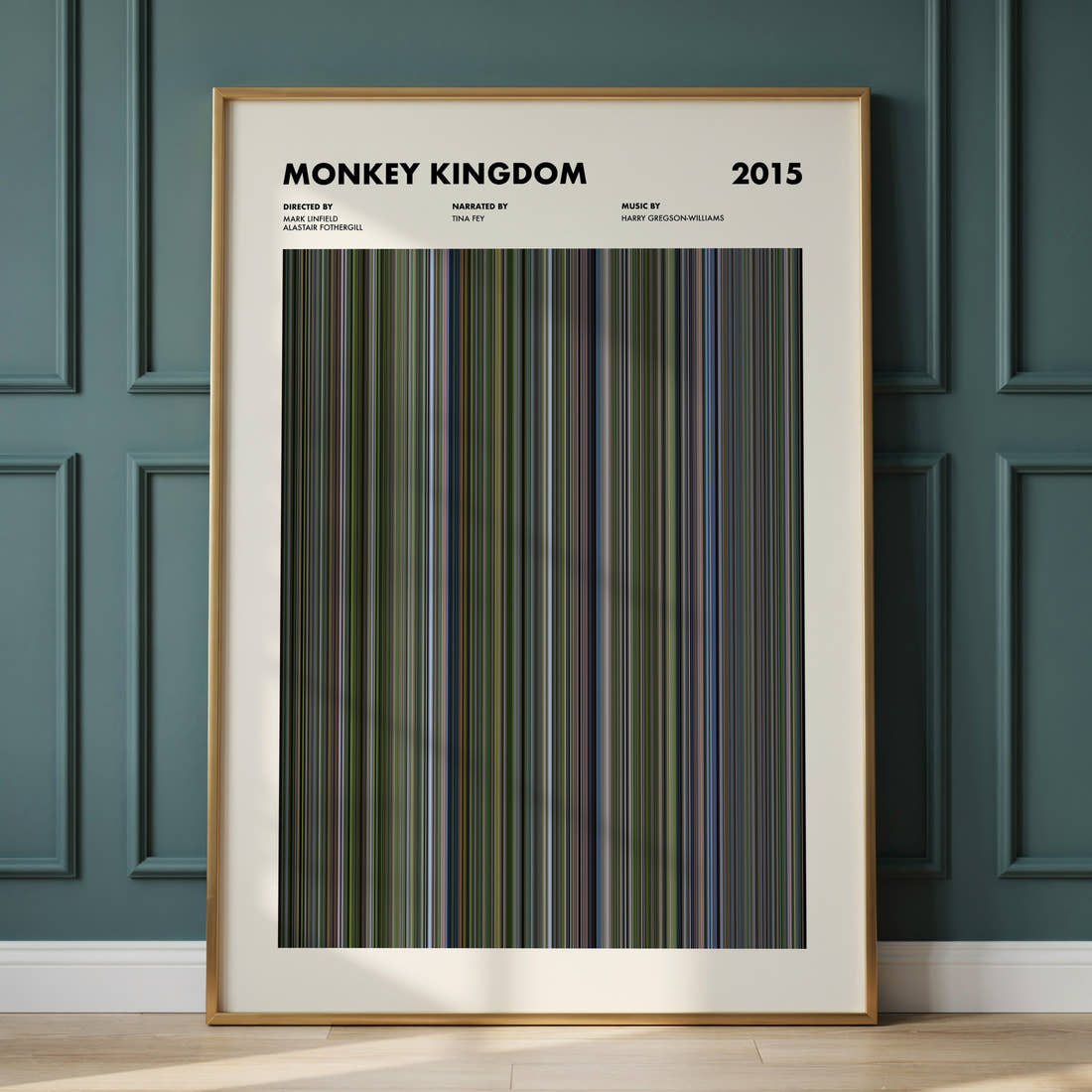 Monkey Kingdom Movie Barcode Poster framed and leaning against a panelled wall
