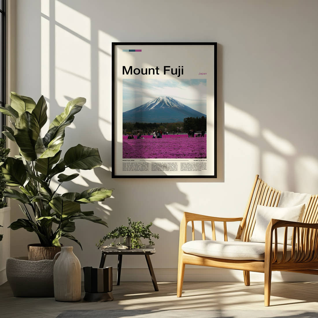 Mount Fuji Pink Flower Fields Travel Print framed on a pale wall beside houseplants