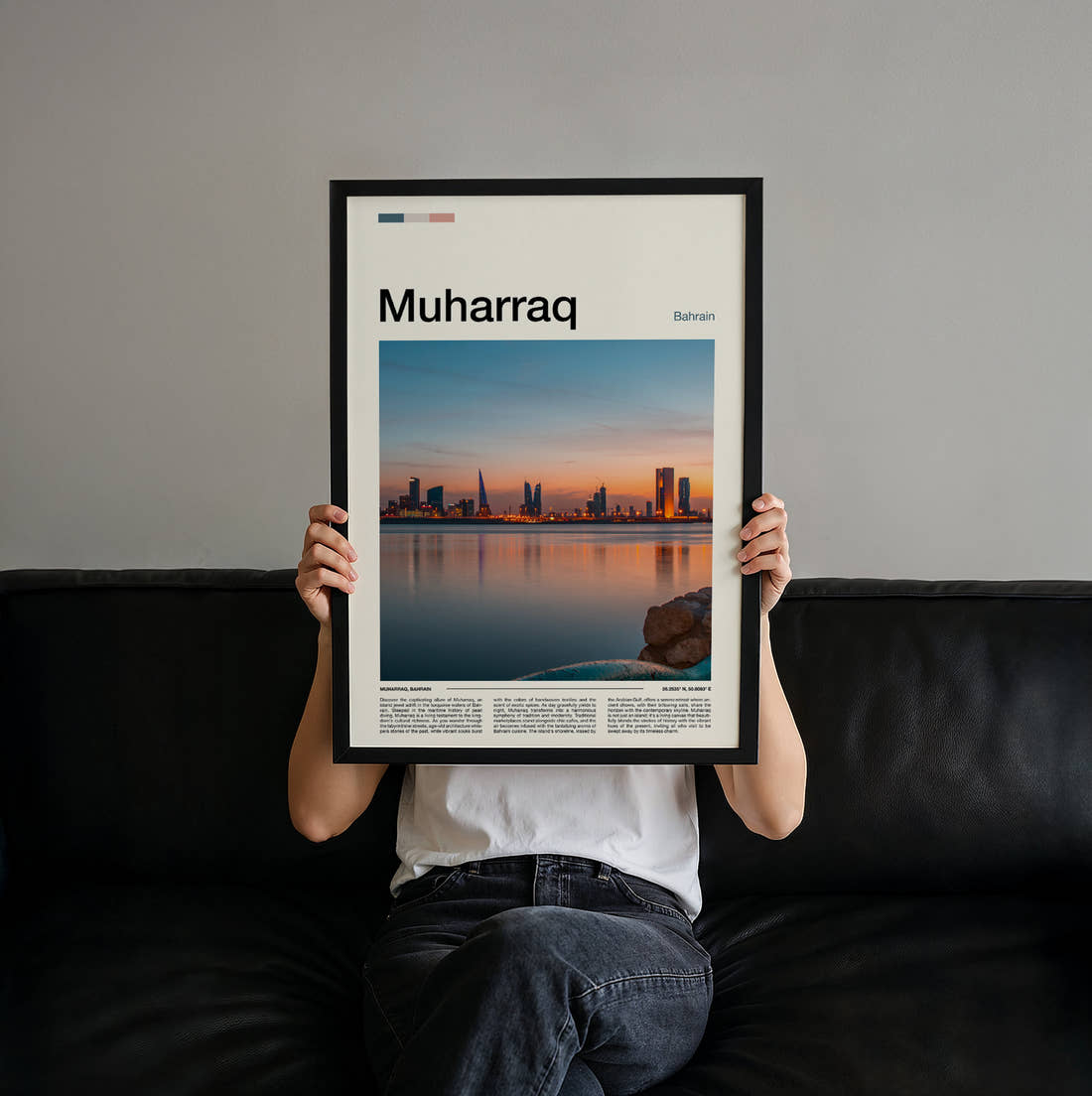 Muharraq Skyline Across The Water Travel Print held up by hand to show the size of the print