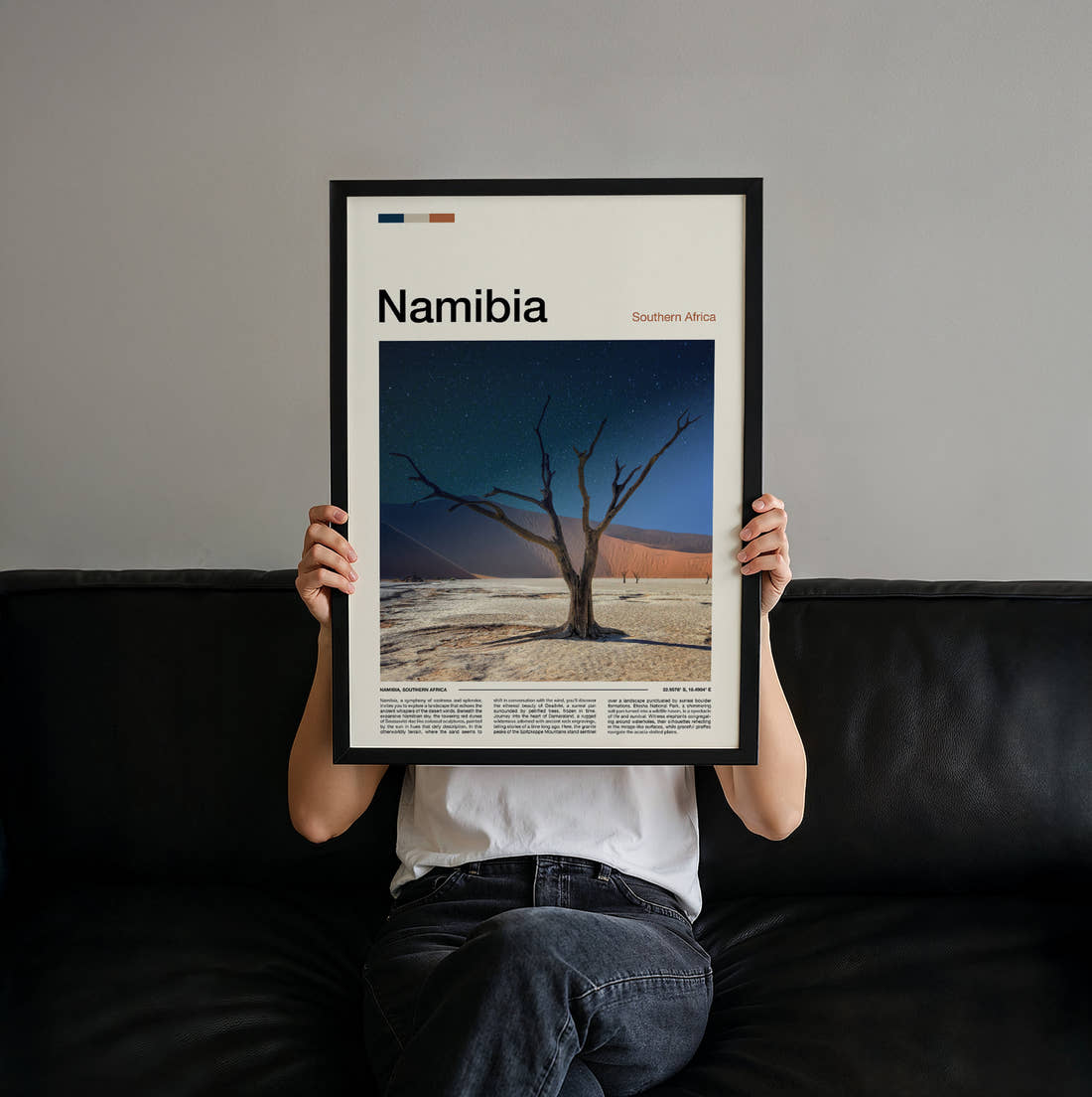 Namibia Dead Tree And Dune Travel Print held up by hand to show the size of the print