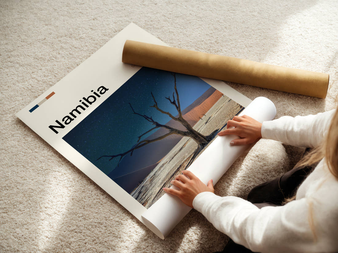 Namibia Dead Tree And Dune Travel Print being unrolled from its postal tube