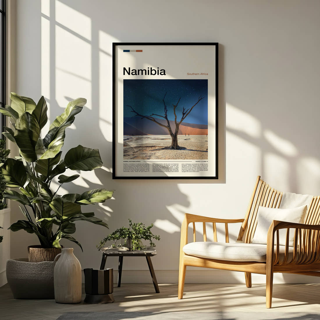 Namibia Dead Tree And Dune Travel Print framed on a pale wall beside houseplants