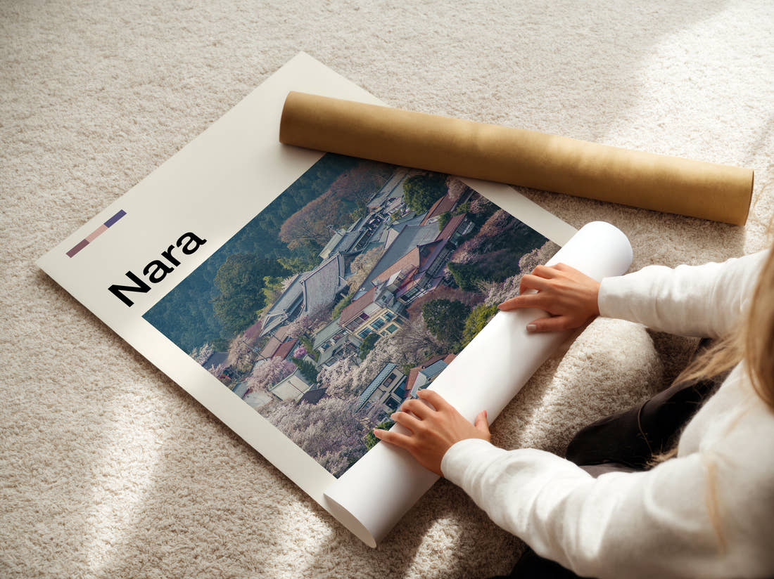 Nara Village Rooftops And Blossom Travel Print being unrolled from its postal tube