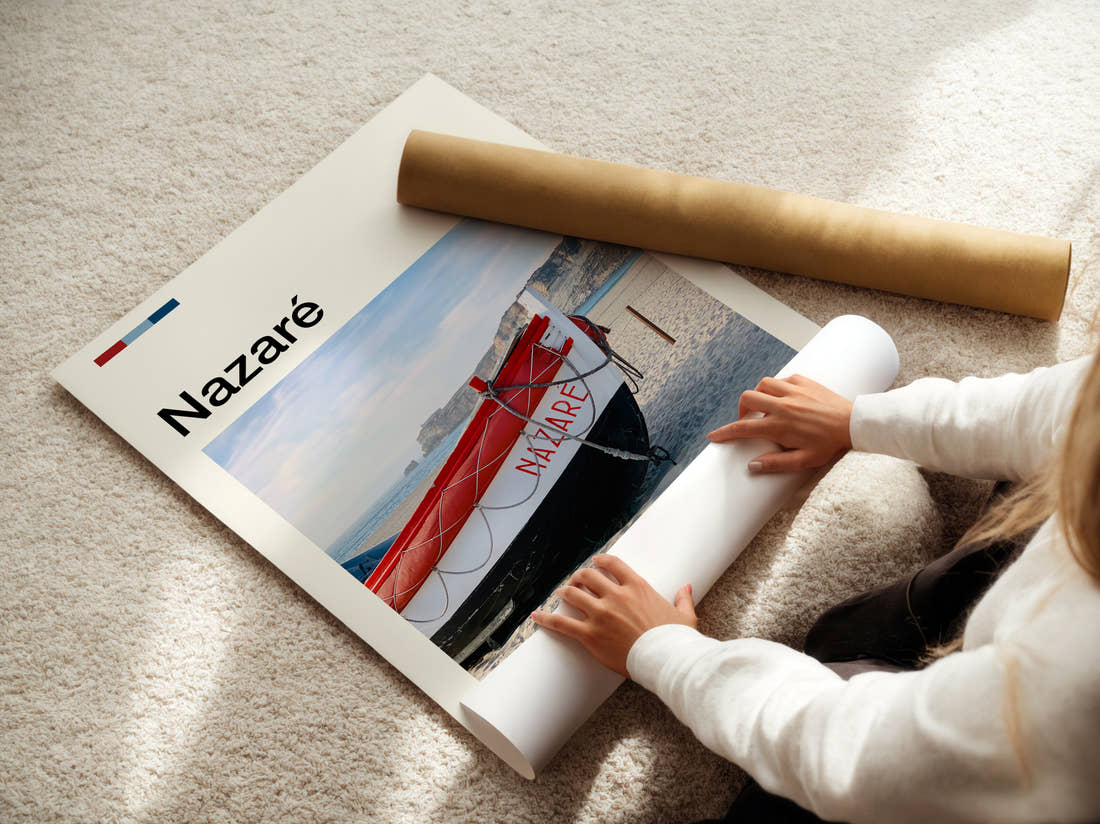 Nazare Red Boat On The Beach Travel Print being unrolled from its postal tube