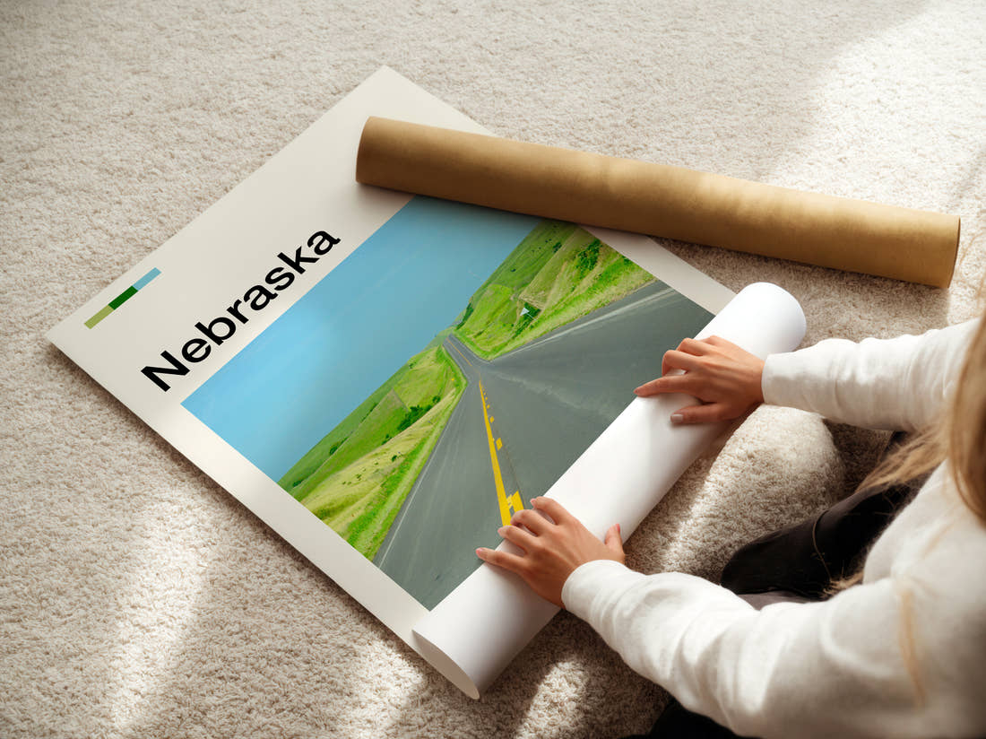 Nebraska Road Through Green Hills Travel Print being unrolled from its postal tube
