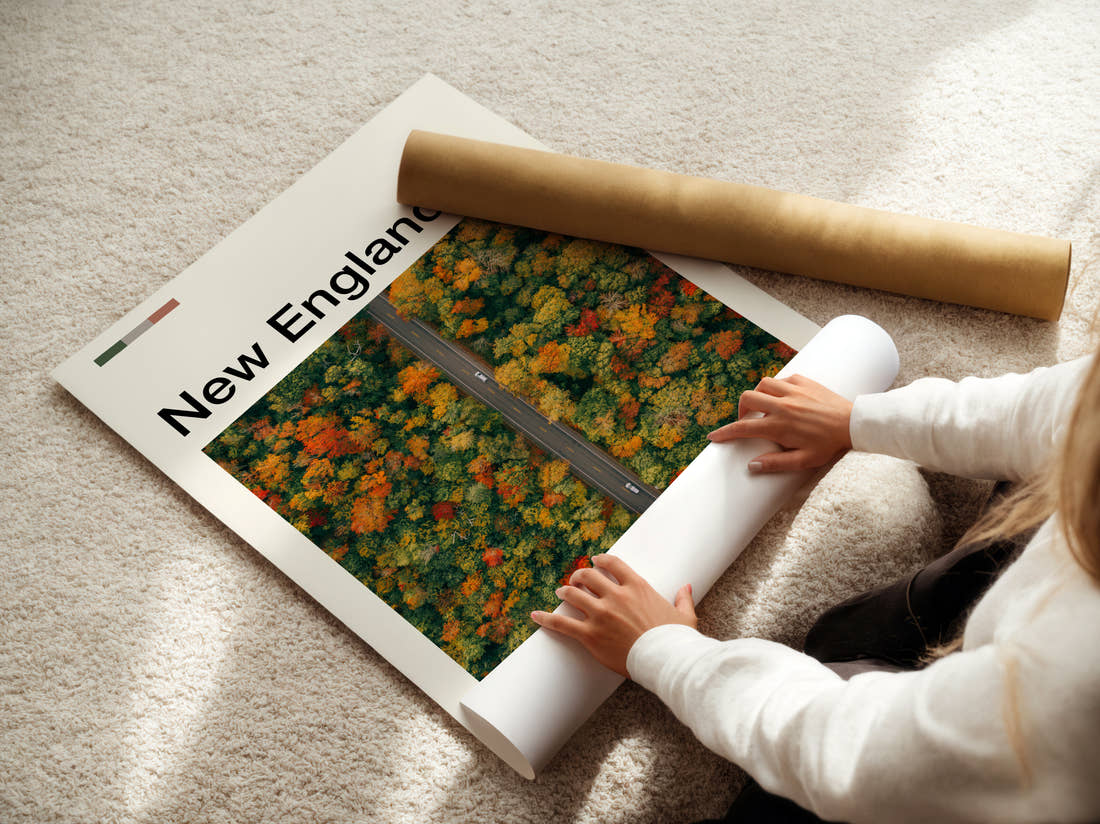 New England Road Through Autumn Trees Travel Print being unrolled from its postal tube