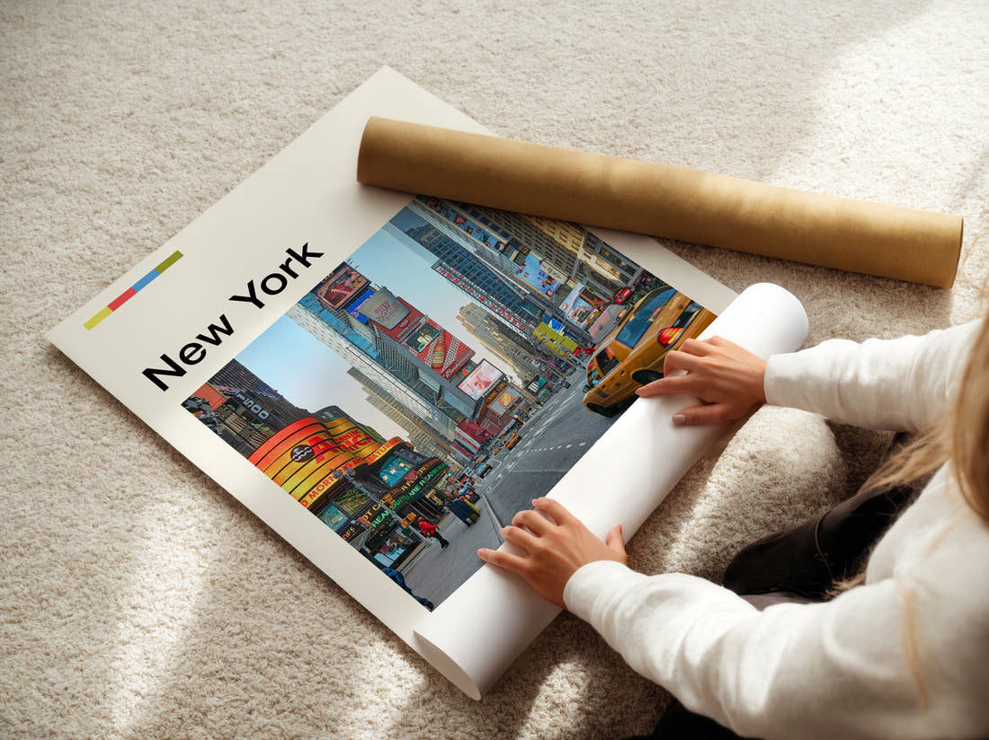 New York Times Square Travel Print being unrolled from its postal tube