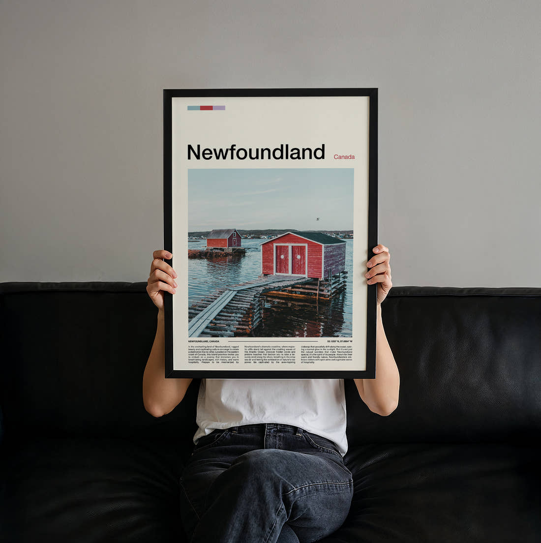 Newfoundland Red Boathouse Travel Print held up by hand to show the size of the print