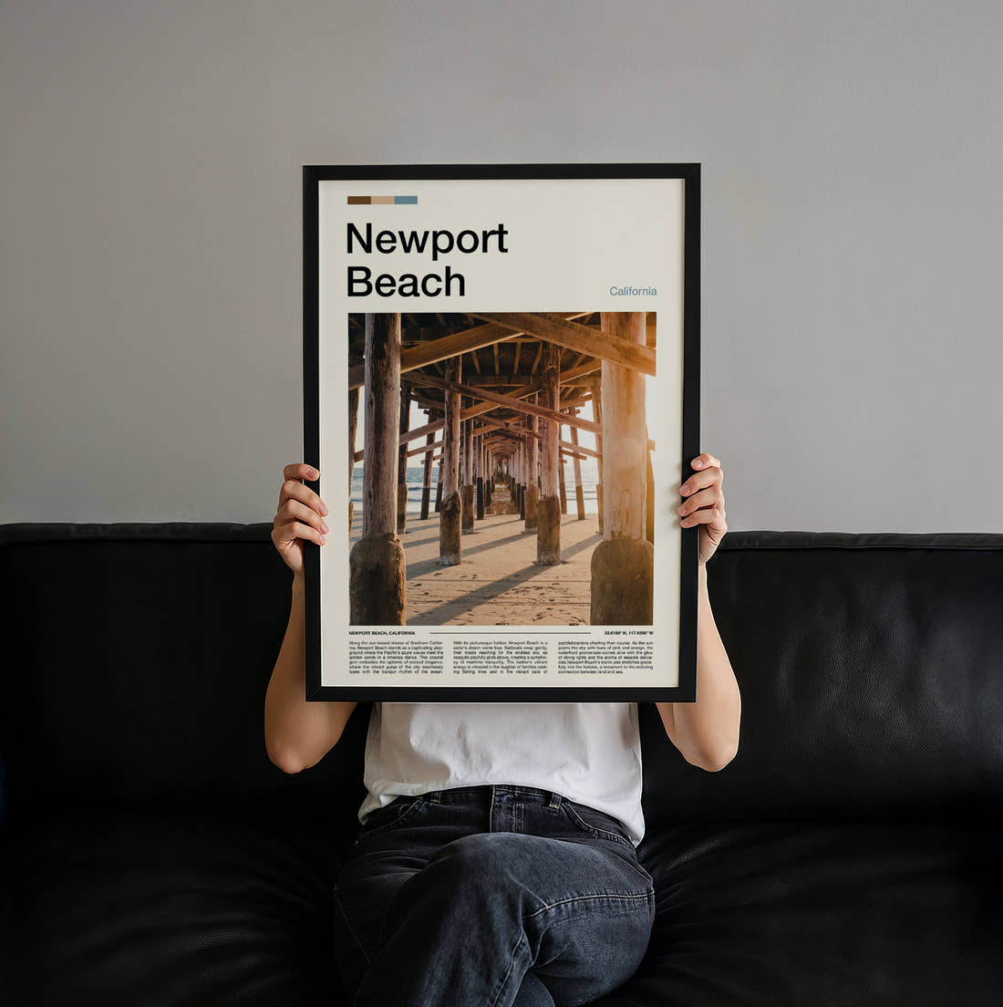 Newport Beach Under The Pier Travel Print held up by hand to show the size of the print