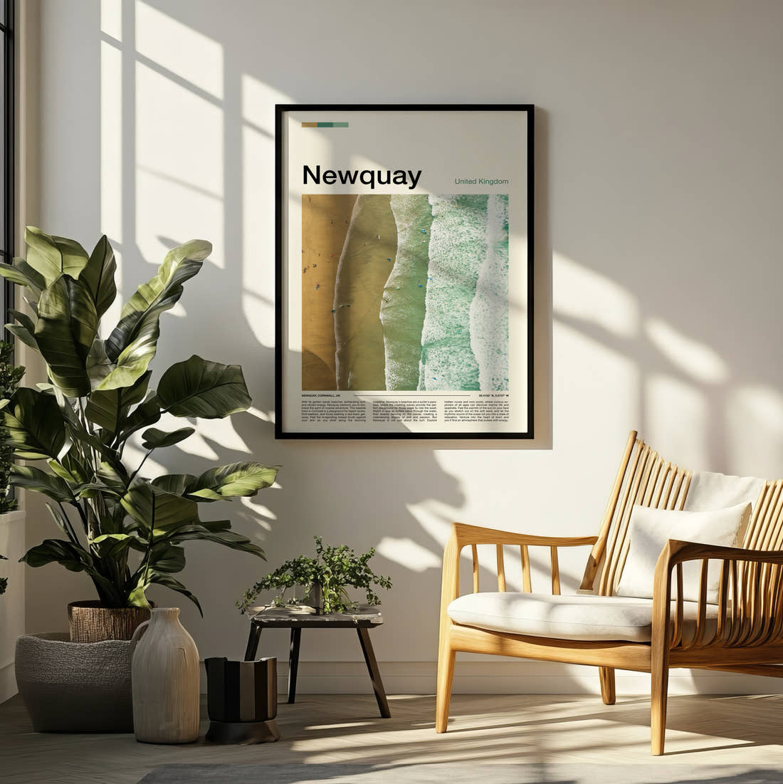 Newquay Aerial View Of The Beach Travel Print framed on a pale wall beside houseplants