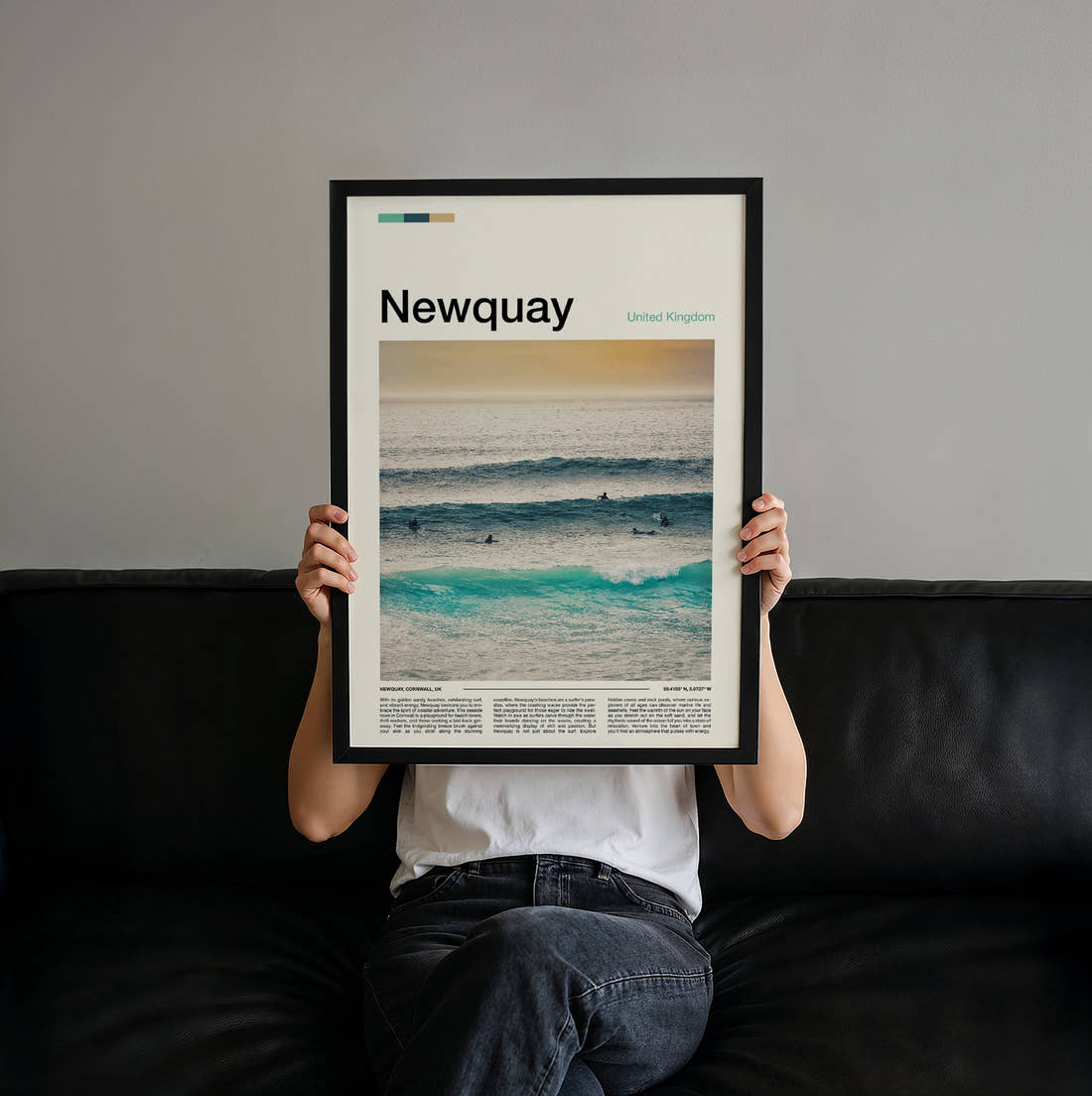 Newquay Surfers In The Waves Travel Print held up by hand to show the size of the print