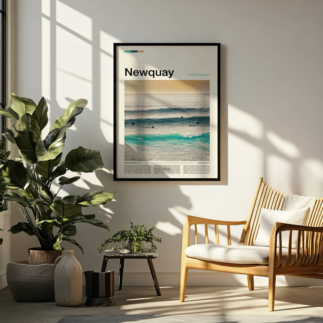Newquay Surfers In The Waves Travel Print framed on a pale wall beside houseplants
