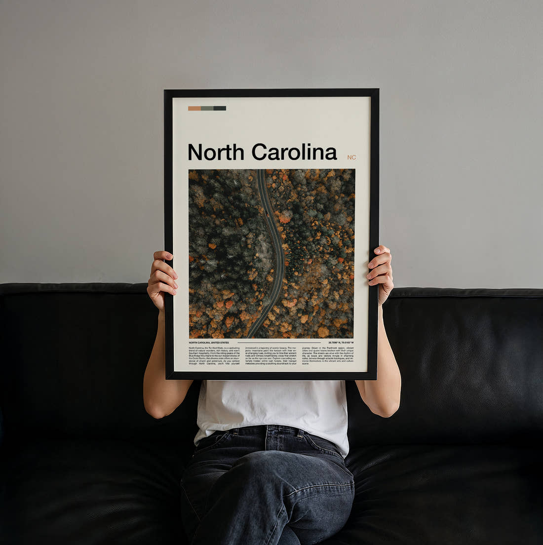 North Carolina Road Through Autumn Forest Travel Print held up by hand to show the size of the print