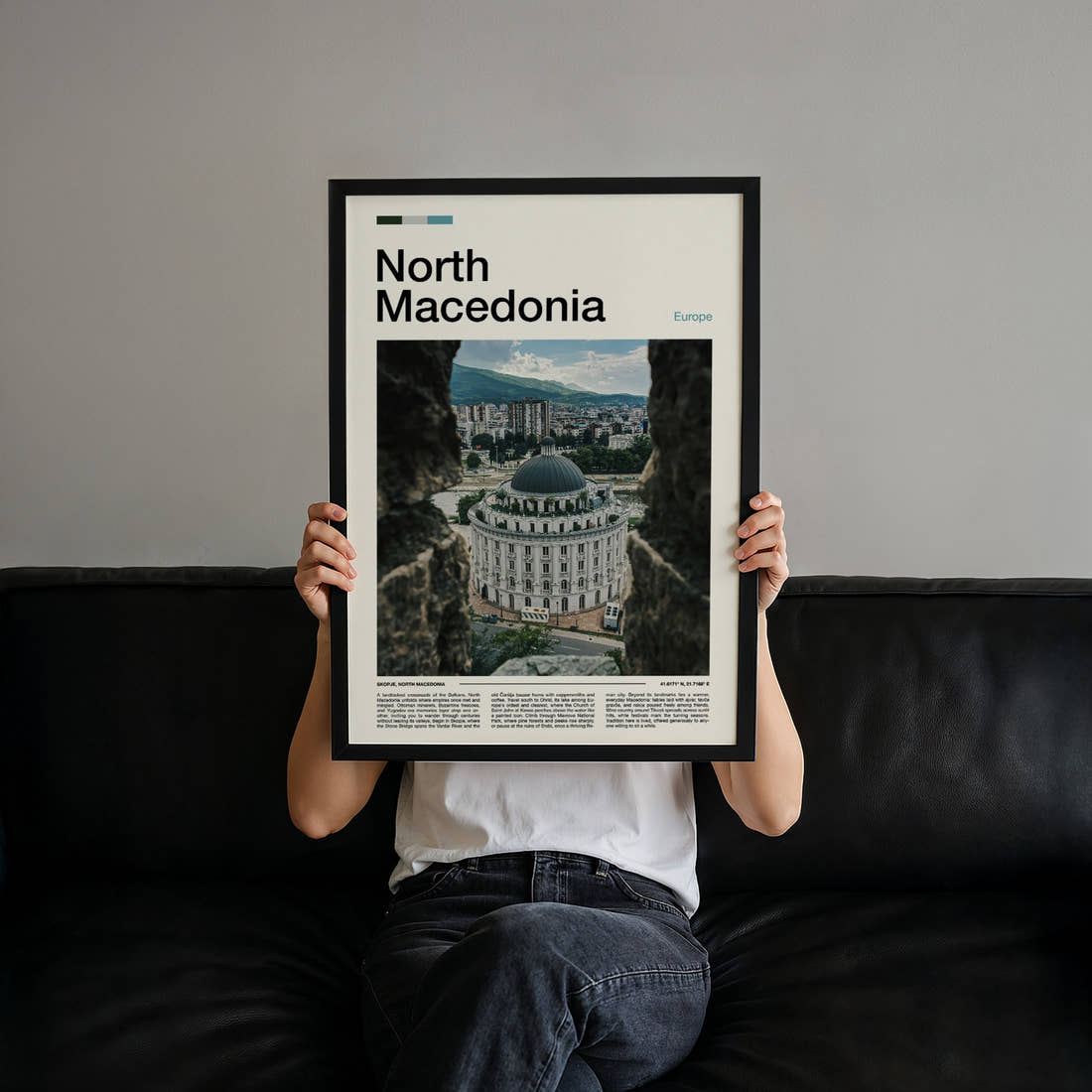 North Macedonia Domed Building View Travel Print held up by hand to show the size of the print