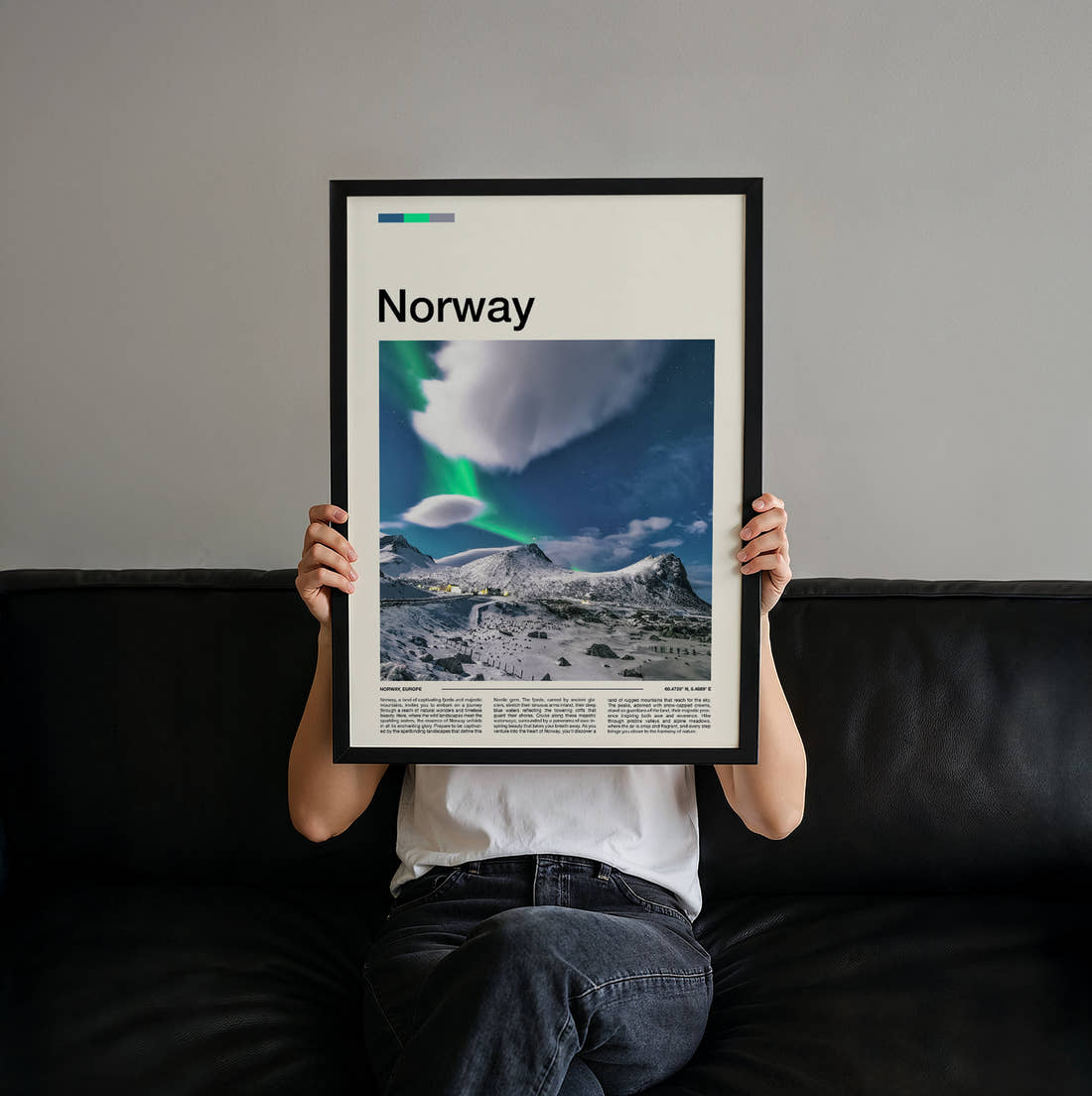 Norway Northern Lights Over Snowy Peaks Travel Print held up by hand to show the size of the print