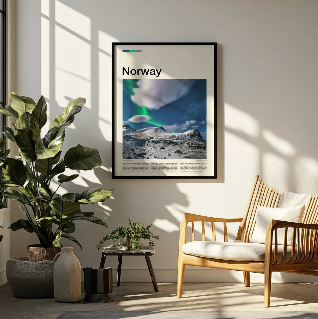Norway Northern Lights Over Snowy Peaks Travel Print framed on a pale wall beside houseplants