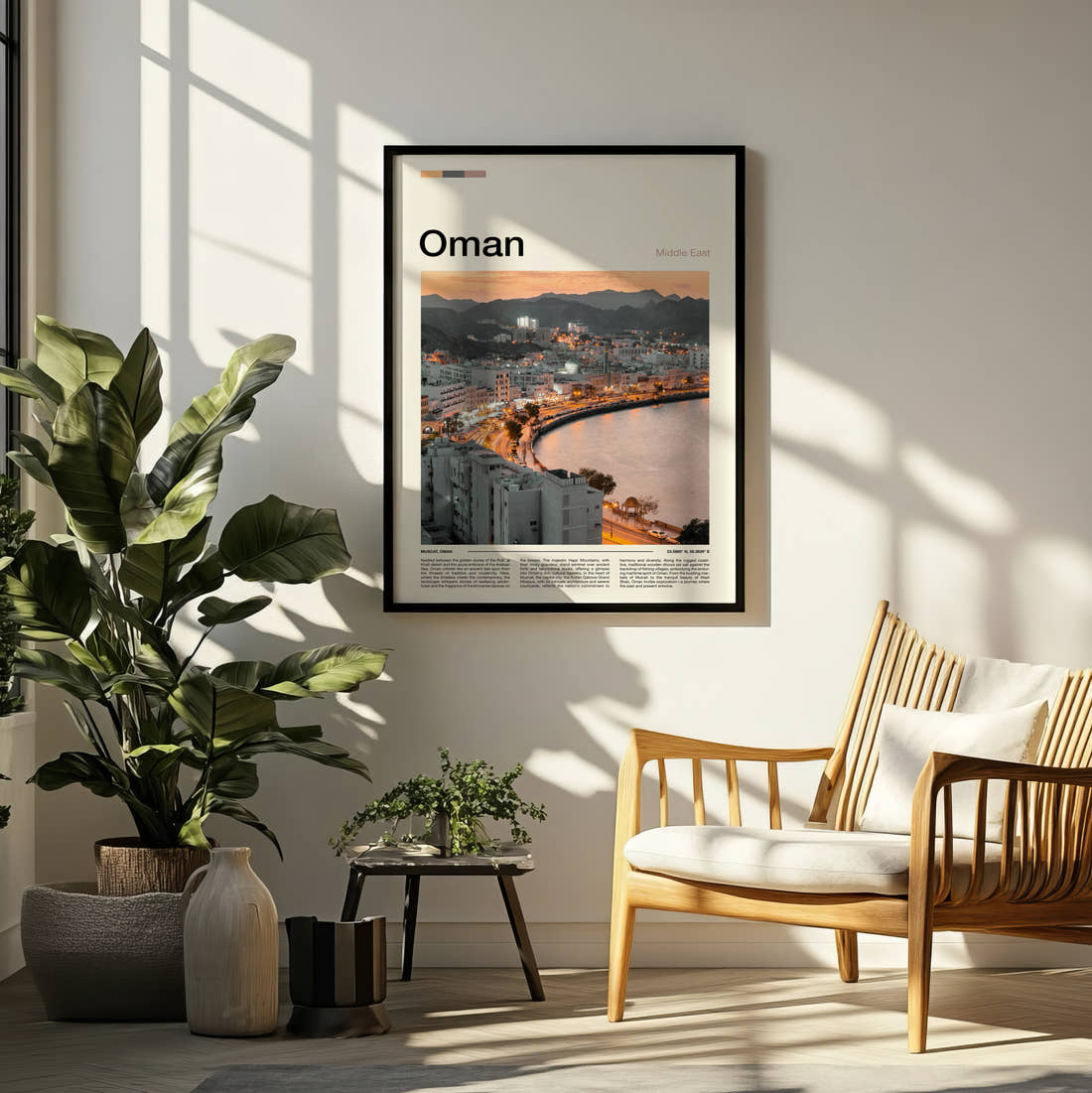 Oman Waterfront Buildings And Bay Travel Print framed on a pale wall beside houseplants