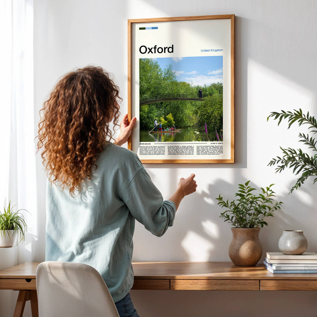 Oxford River Punting Scene Travel Print framed on a pale wall beside houseplants
