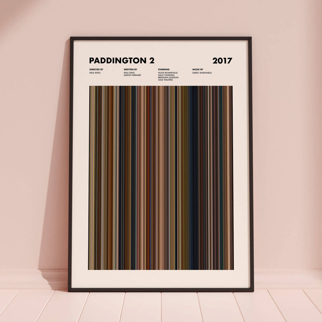Paddington 2 Movie Barcode Poster framed and leaning against a coloured wall