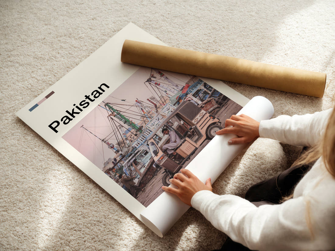 Pakistan Auto Rickshaw And Boats Travel Print being unrolled from its postal tube