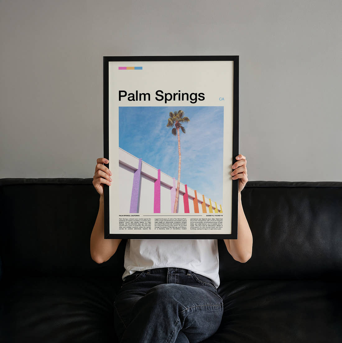 Palm Springs Palm Tree And Pink Wall Travel Print held up by hand to show the size of the print