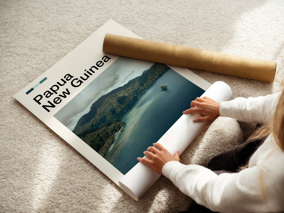 Papua New Guinea Misty Coastal Inlet Travel Print being unrolled from its postal tube