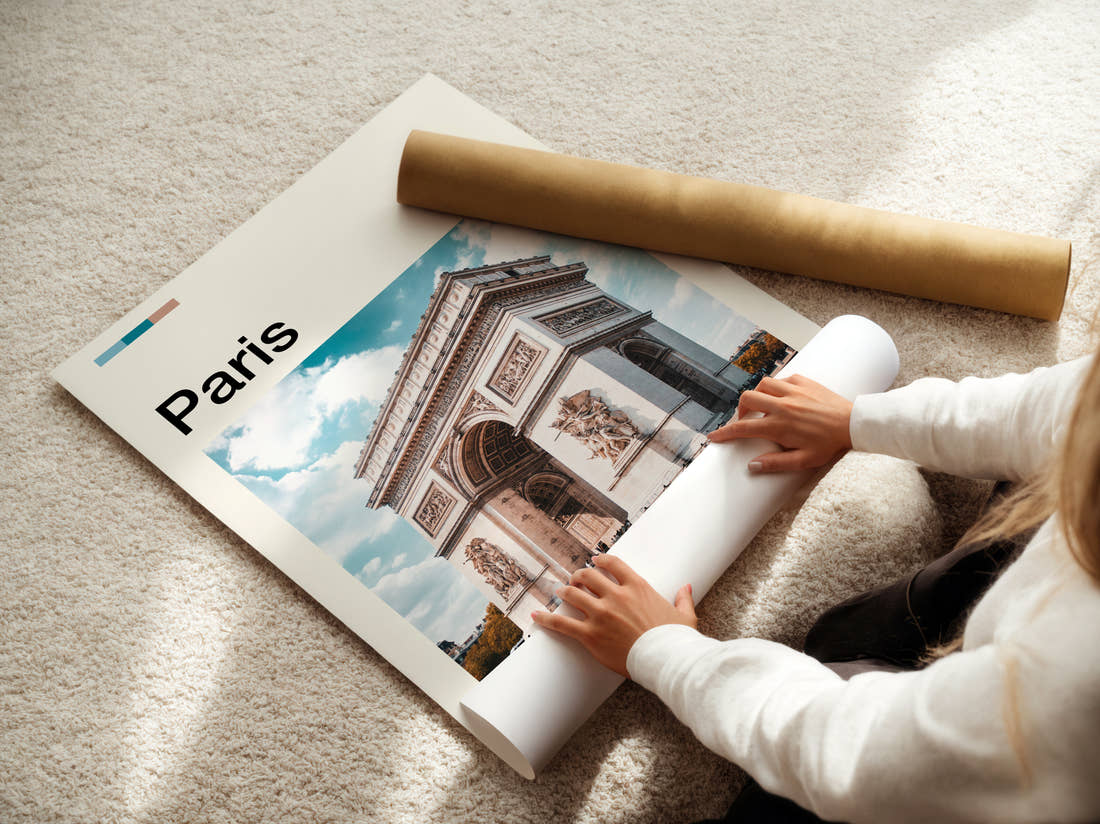 Paris Arc De Triomphe Travel Print being unrolled from its postal tube