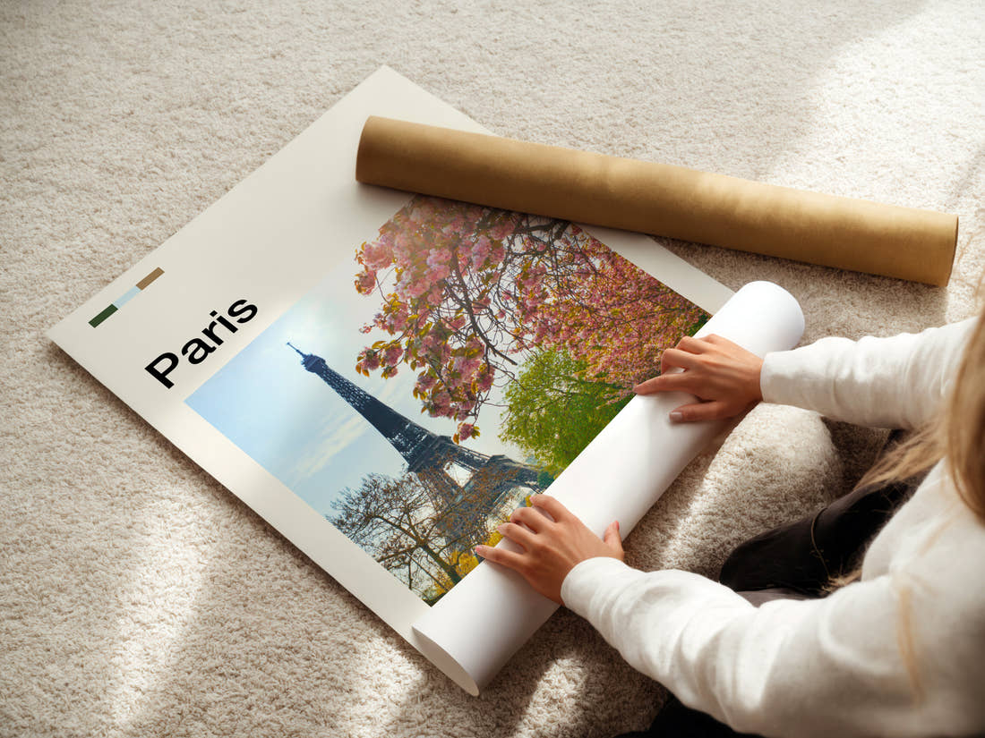 Paris Blossom-Framed Eiffel Tower Travel Print being unrolled from its postal tube