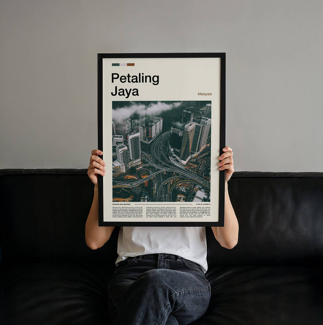 Petaling Aerial View Of Interchange Travel Print held up by hand to show the size of the print