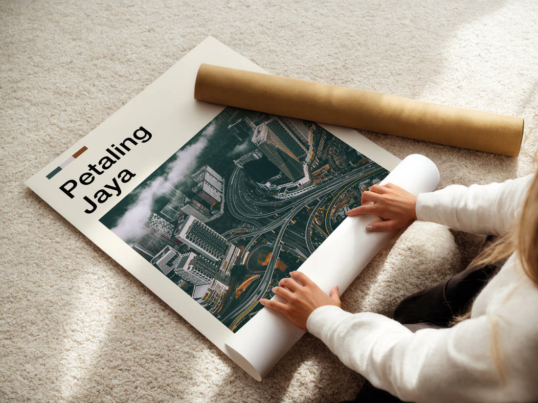 Petaling Aerial View Of Interchange Travel Print being unrolled from its postal tube