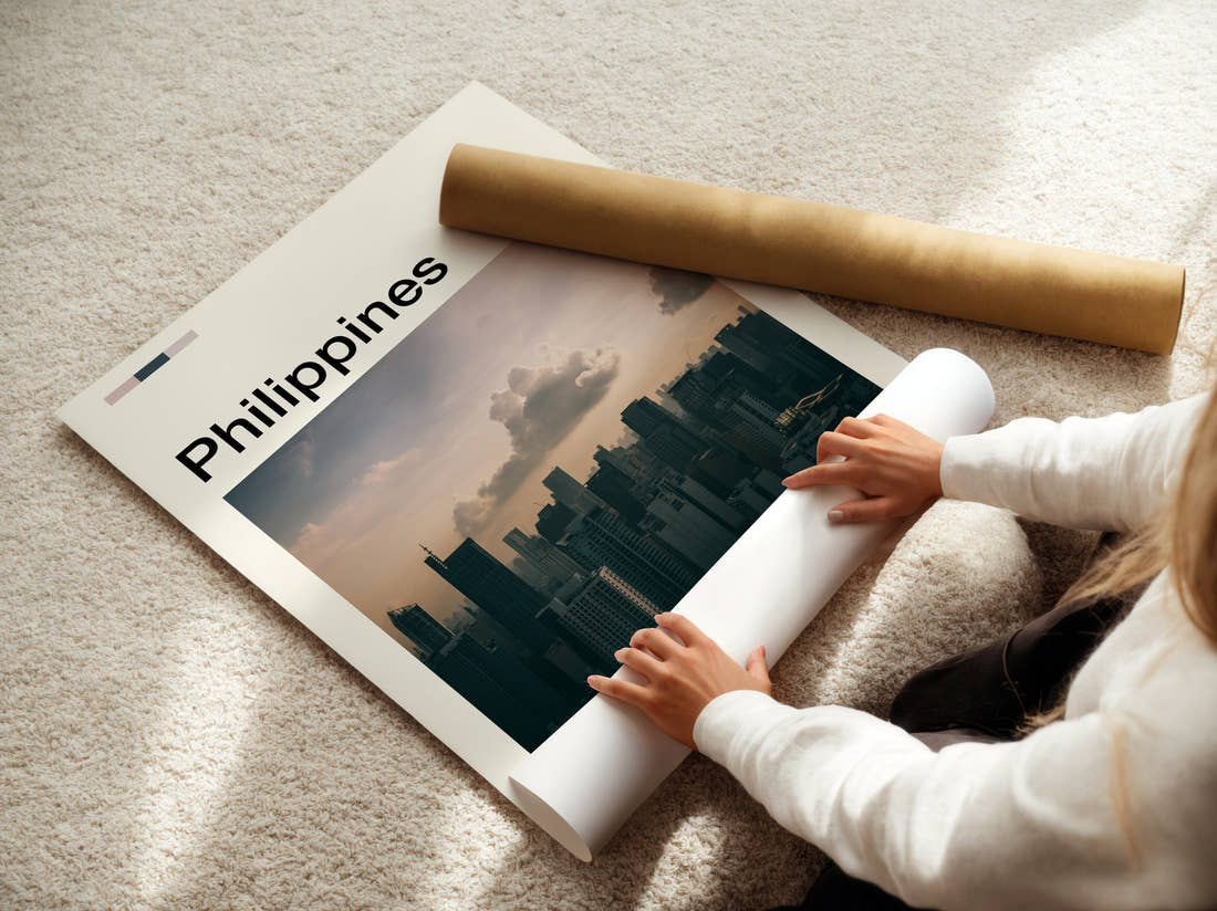 Philippines Moody Skyline Travel Print being unrolled from its postal tube