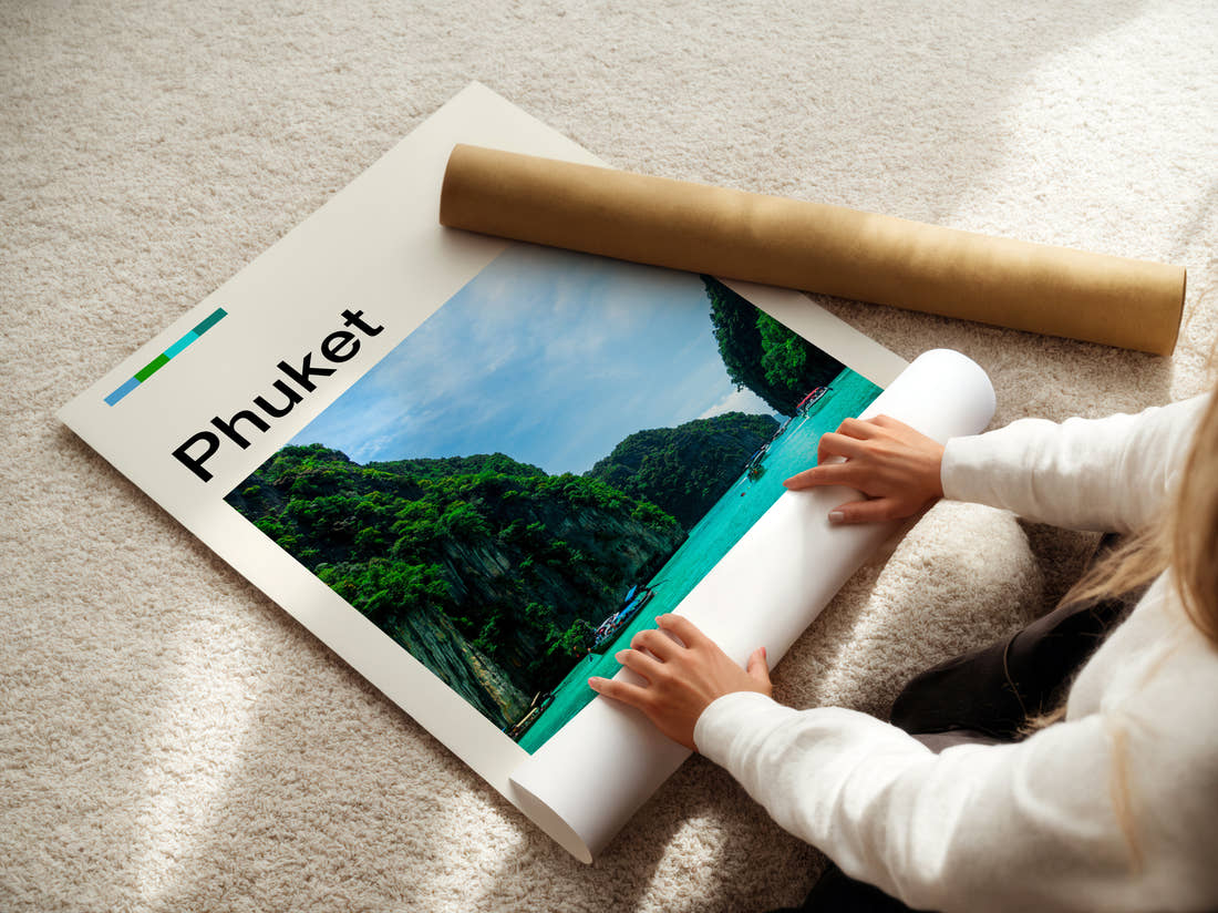 Phuket Limestone Cliffs And Bay Travel Print being unrolled from its postal tube