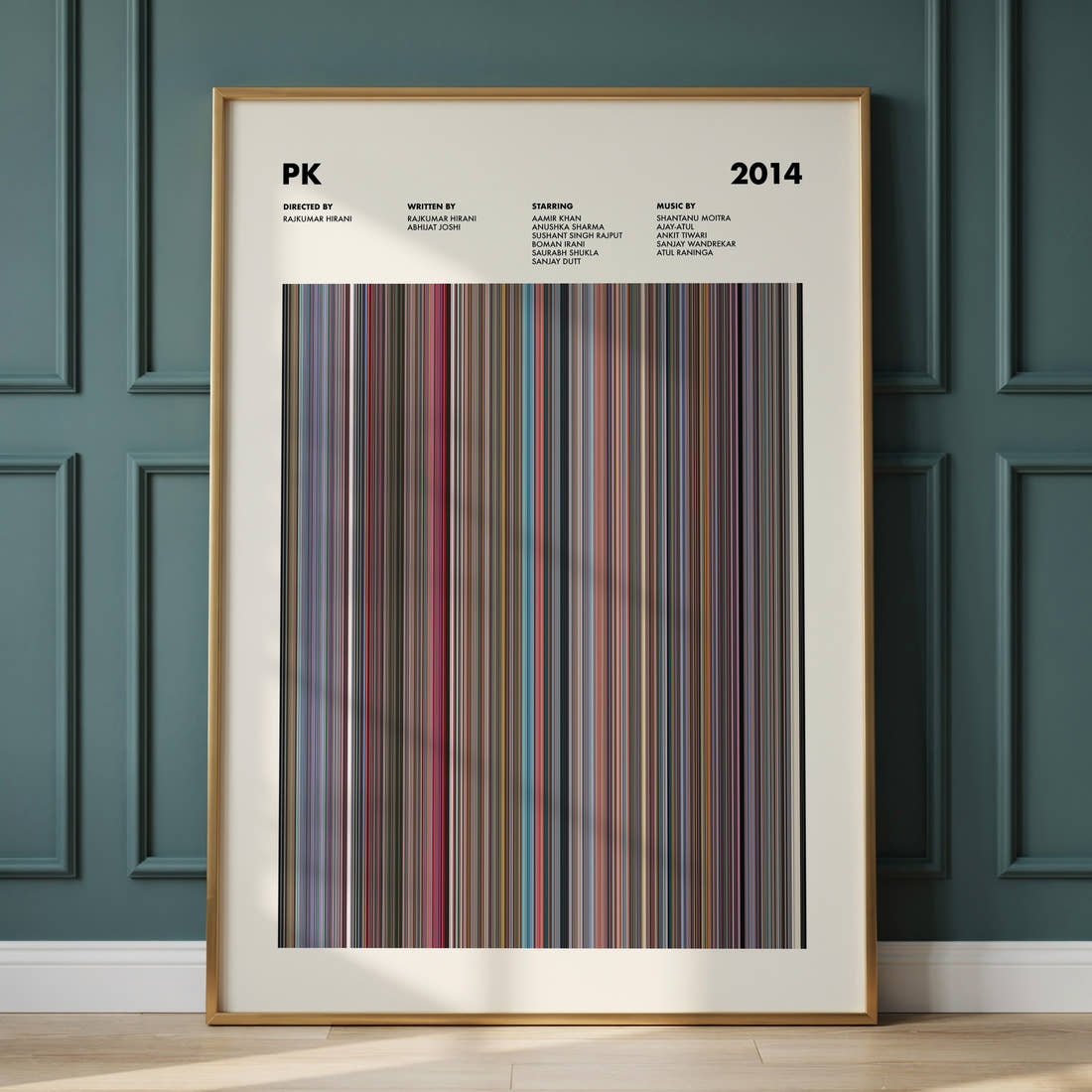 PK Movie Barcode Poster framed and leaning against a panelled wall