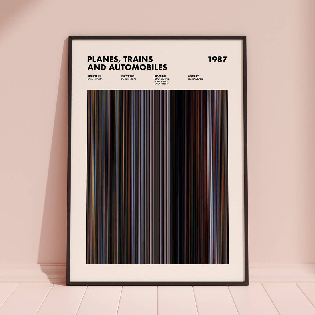 Planes, Trains and Automobiles Movie Barcode Poster framed and leaning against a coloured wall
