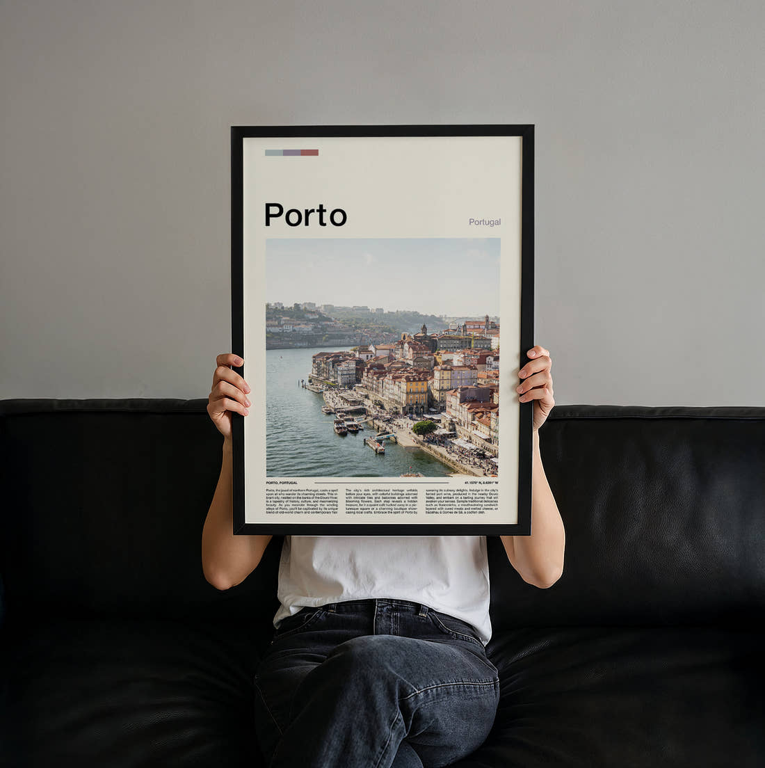 Porto Riverside Houses Travel Print held up by hand to show the size of the print