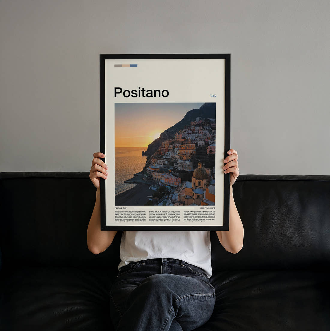 Positano Cliffside Town At Sunset Travel Print held up by hand to show the size of the print