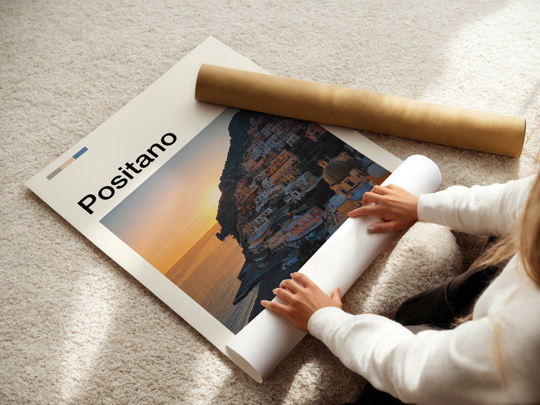 Positano Cliffside Town At Sunset Travel Print being unrolled from its postal tube