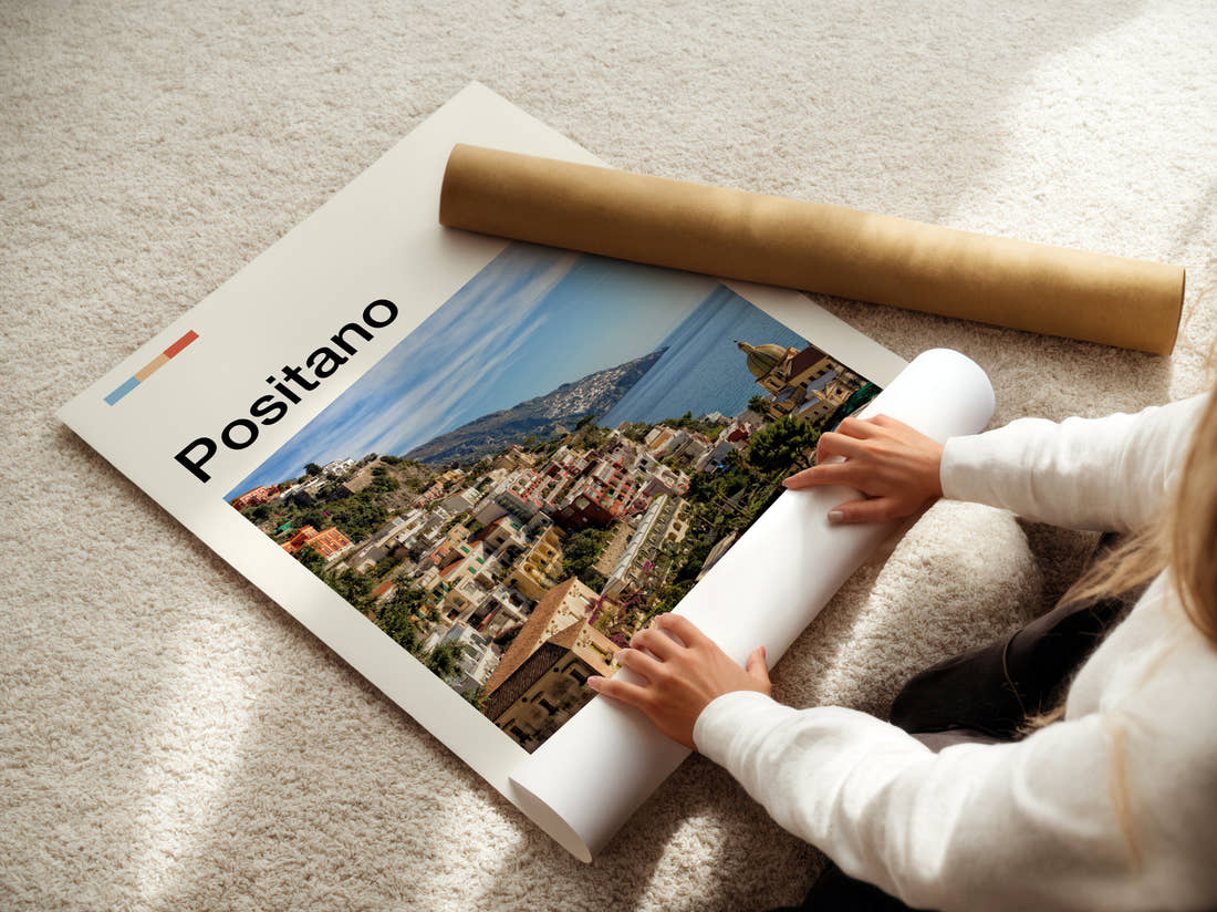 Positano Hillside Town And Sea Travel Print being unrolled from its postal tube