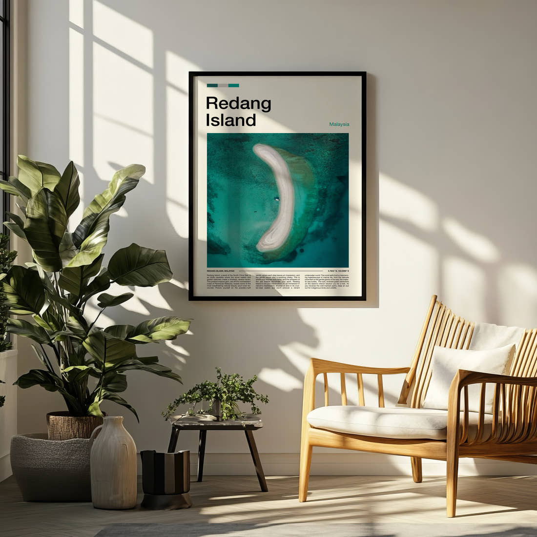 Redang Curved Sandbar From Above Travel Print framed on a pale wall beside houseplants