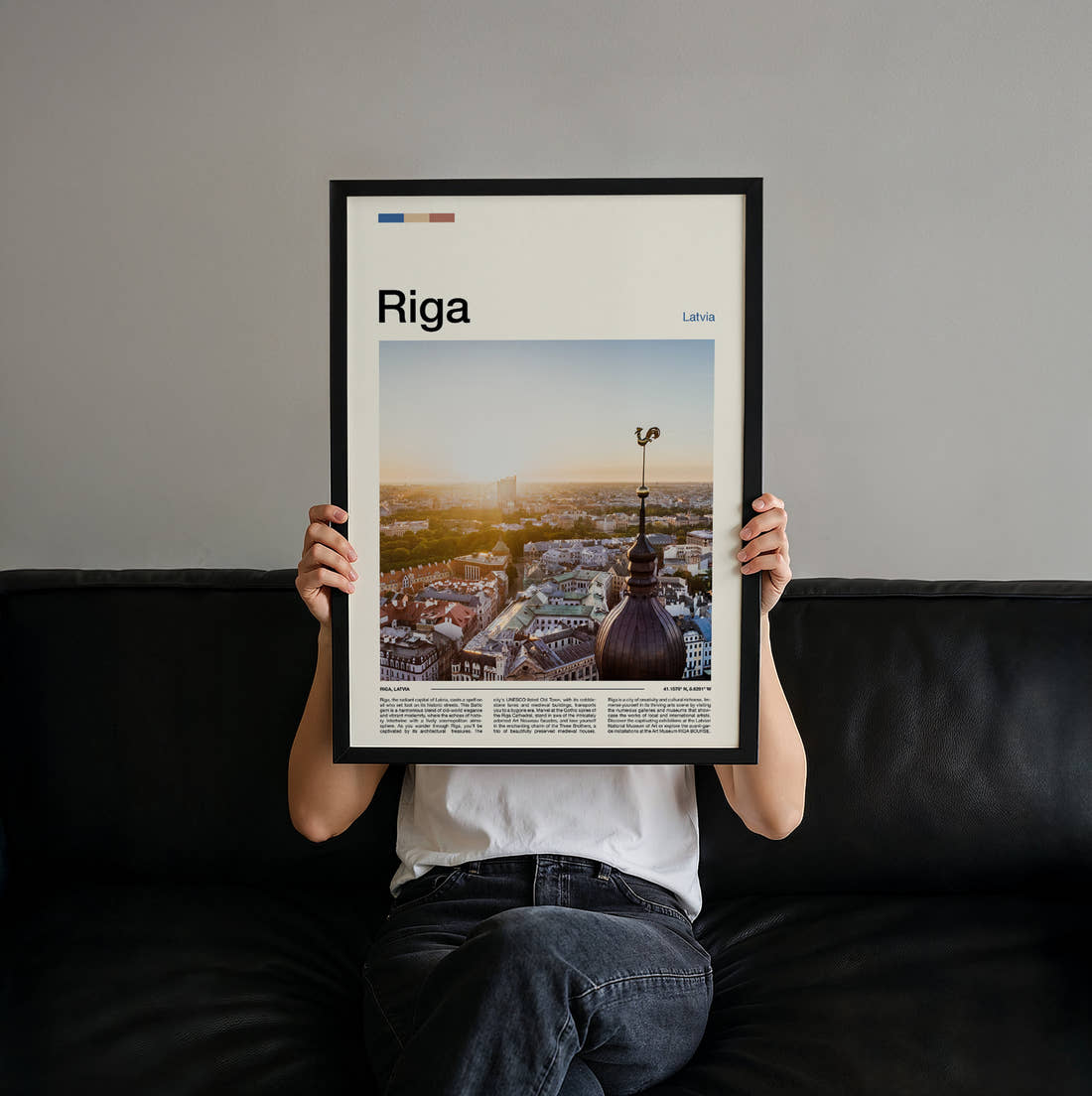 Riga Rooftops And Weathervane Travel Print held up by hand to show the size of the print