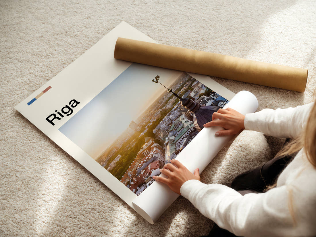 Riga Rooftops And Weathervane Travel Print being unrolled from its postal tube