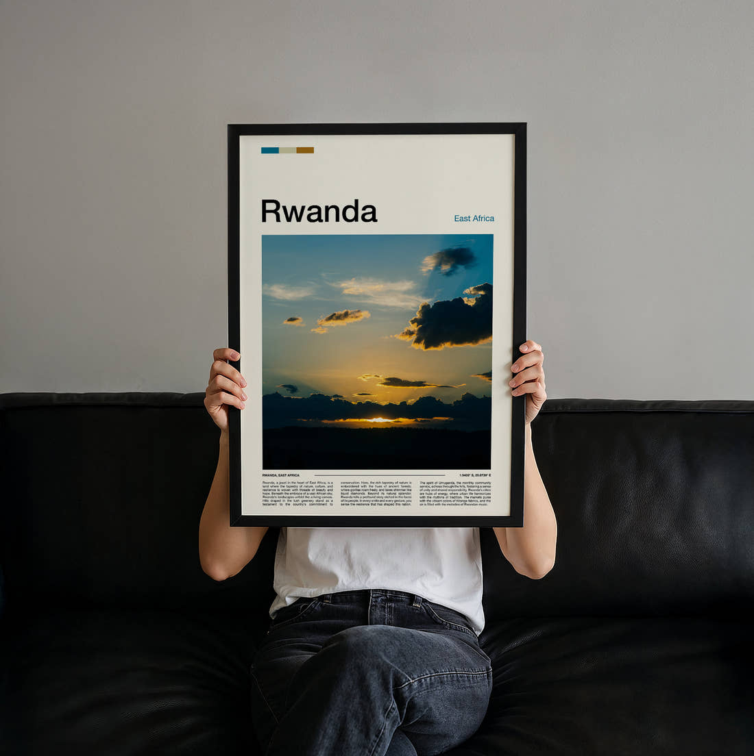 Rwanda Sunset Travel Print held up by hand to show the size of the print