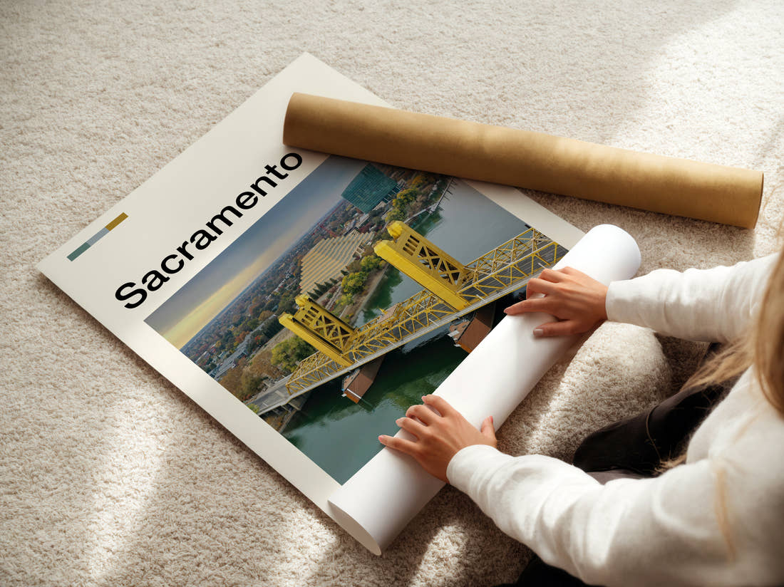Sacramento Tower Bridge Across The River Travel Print being unrolled from its postal tube
