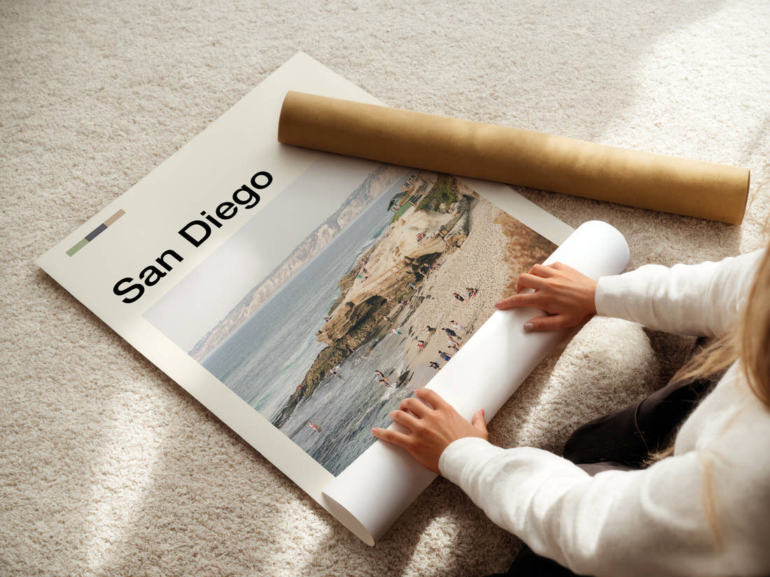 San Diego Beach And Cliffs Travel Print being unrolled from its postal tube