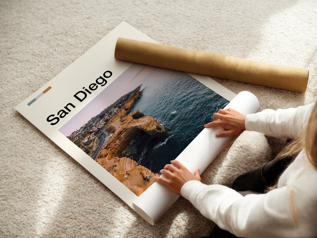 San Diego Coastal Cliffs Travel Print being unrolled from its postal tube